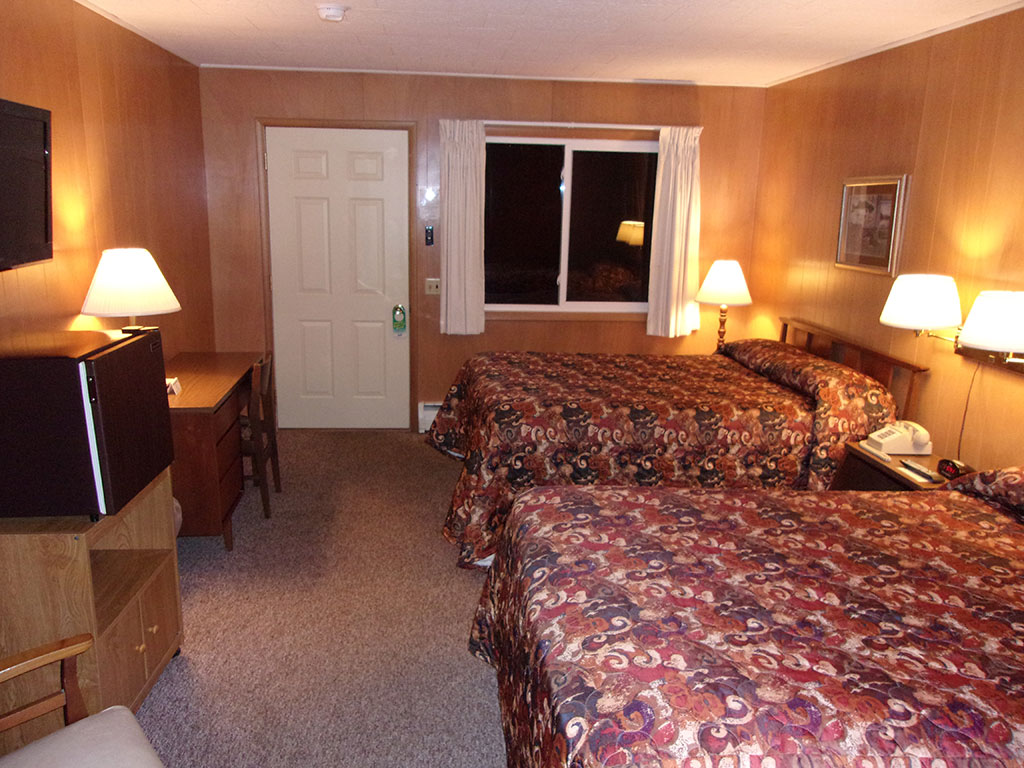 standard size guest room with 2 full size beds